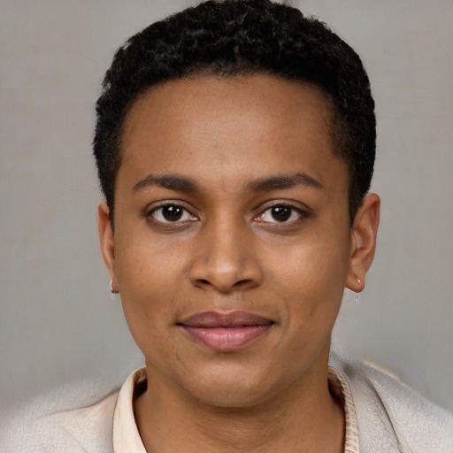 Joyful black young-adult female with short  black hair and brown eyes