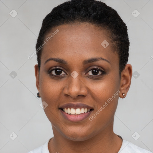 Joyful black young-adult female with short  black hair and brown eyes