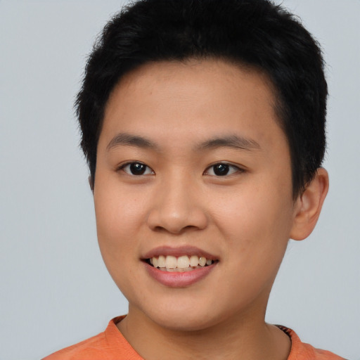 Joyful asian young-adult female with short  black hair and brown eyes