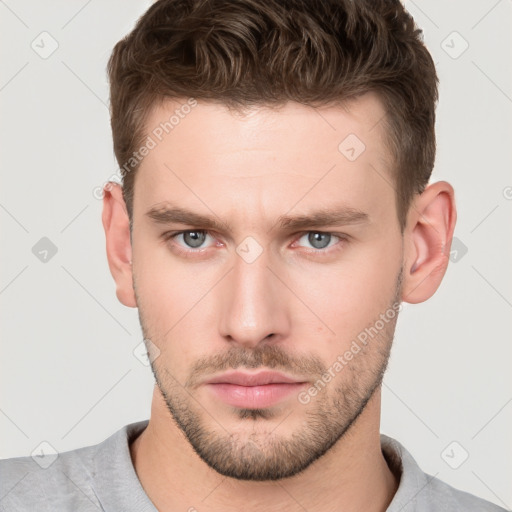 Neutral white young-adult male with short  brown hair and brown eyes