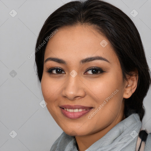 Joyful asian young-adult female with medium  brown hair and brown eyes