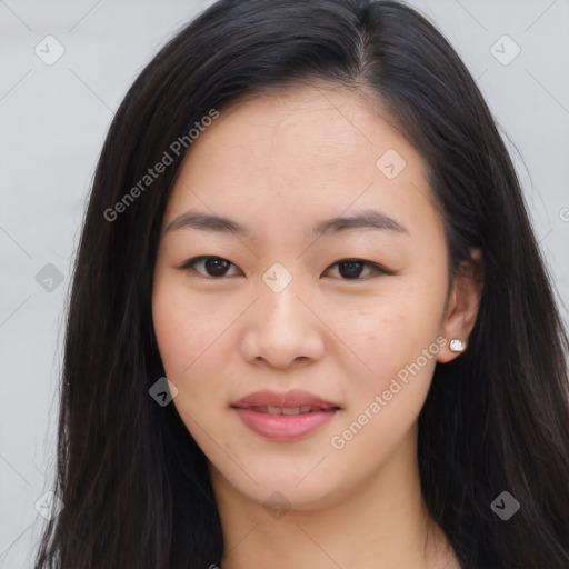 Joyful asian young-adult female with long  brown hair and brown eyes