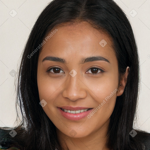 Joyful latino young-adult female with long  brown hair and brown eyes