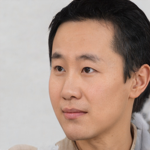 Neutral asian young-adult male with short  black hair and brown eyes