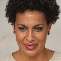 Joyful black adult female with short  brown hair and brown eyes