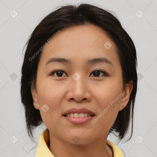 Joyful asian young-adult female with medium  brown hair and brown eyes