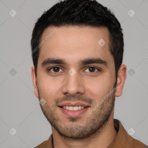 Joyful white young-adult male with short  black hair and brown eyes