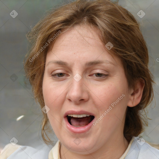 Joyful white adult female with medium  brown hair and blue eyes