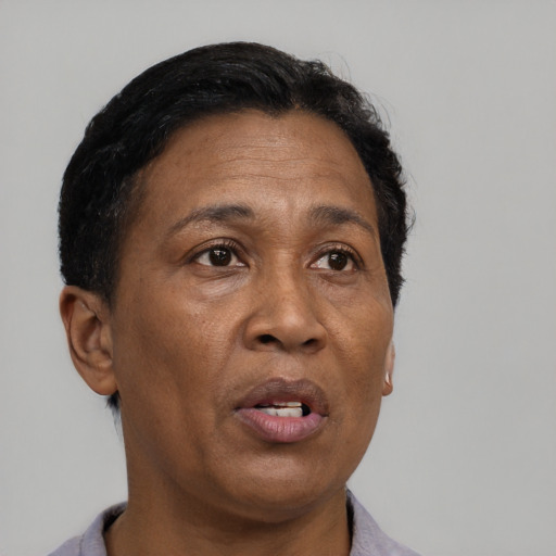 Neutral black adult female with short  black hair and brown eyes