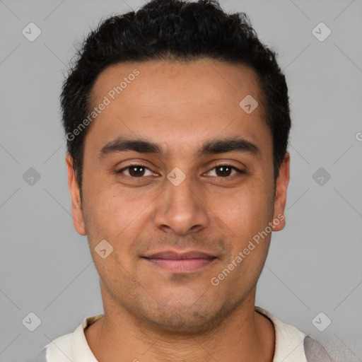 Joyful latino young-adult male with short  brown hair and brown eyes