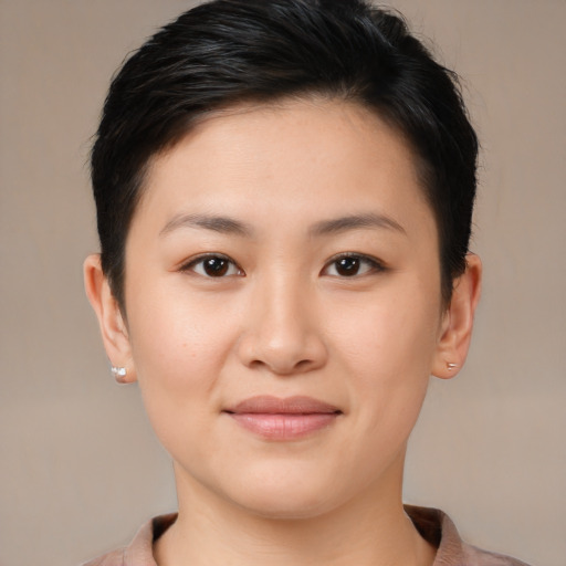 Joyful asian young-adult female with short  brown hair and brown eyes