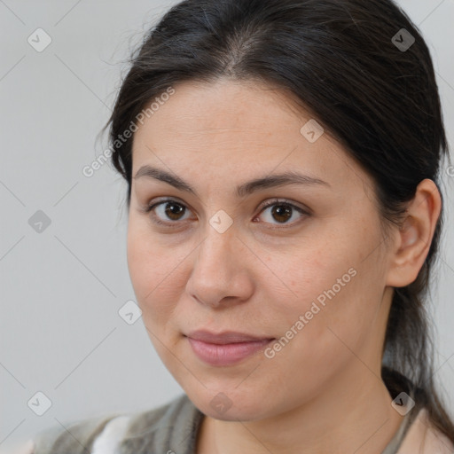 Joyful white adult female with medium  brown hair and brown eyes