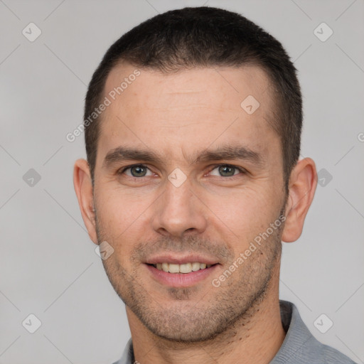 Joyful white young-adult male with short  brown hair and brown eyes