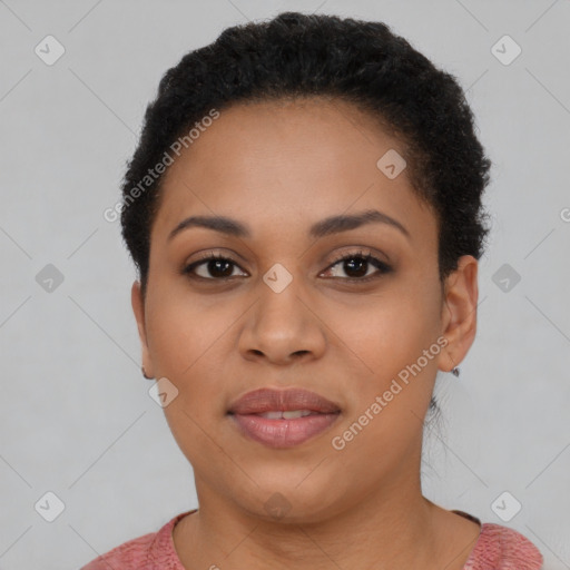 Joyful black young-adult female with short  brown hair and brown eyes