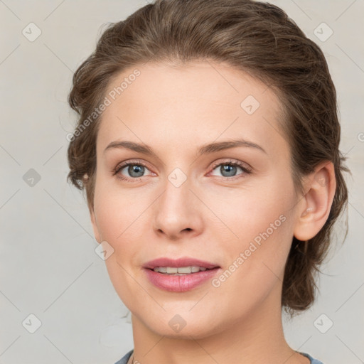 Joyful white young-adult female with medium  brown hair and green eyes