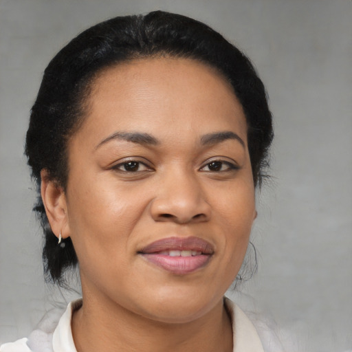 Joyful black young-adult female with medium  brown hair and brown eyes