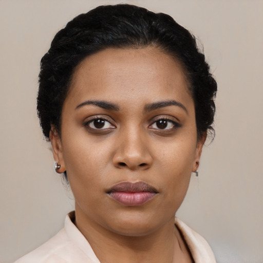 Neutral latino young-adult female with short  black hair and brown eyes