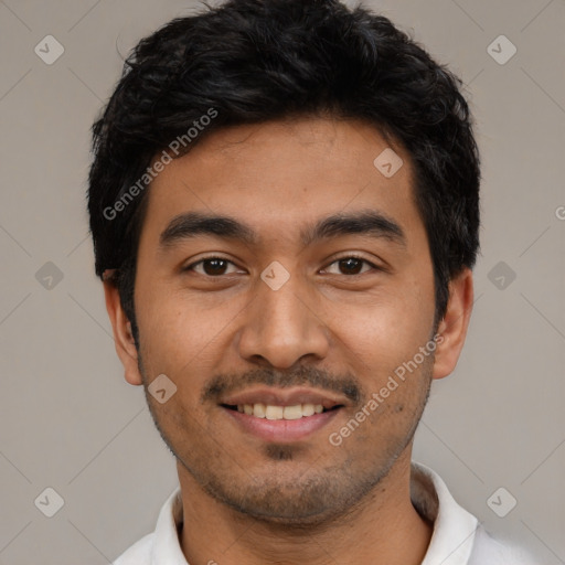 Joyful latino young-adult male with short  black hair and brown eyes