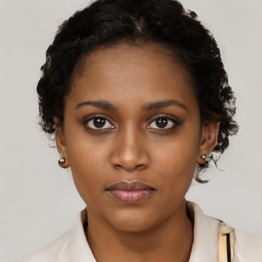 Neutral black young-adult female with short  black hair and brown eyes
