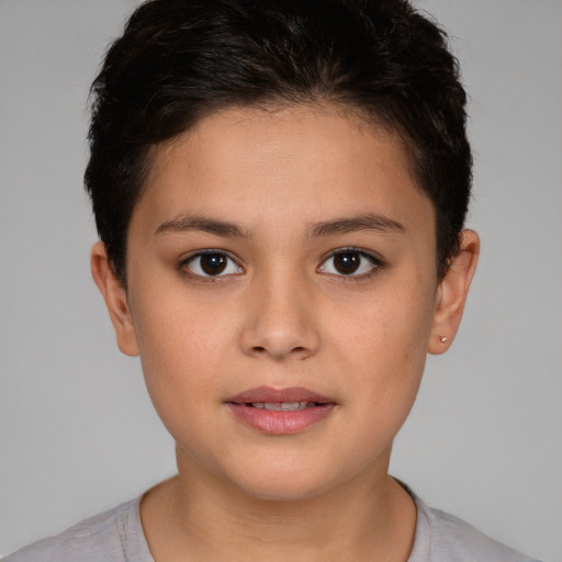 Joyful white child female with short  brown hair and brown eyes