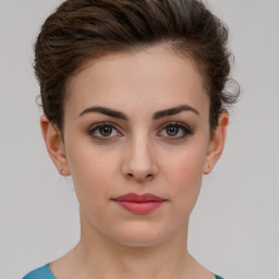 Neutral white young-adult female with short  brown hair and brown eyes