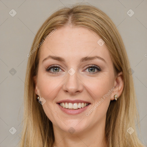 Joyful white young-adult female with long  brown hair and blue eyes