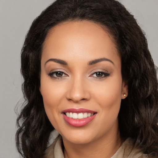 Joyful white young-adult female with long  brown hair and brown eyes