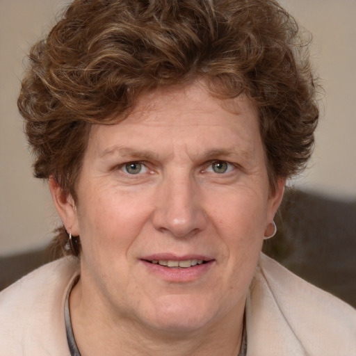 Joyful white adult male with medium  brown hair and blue eyes