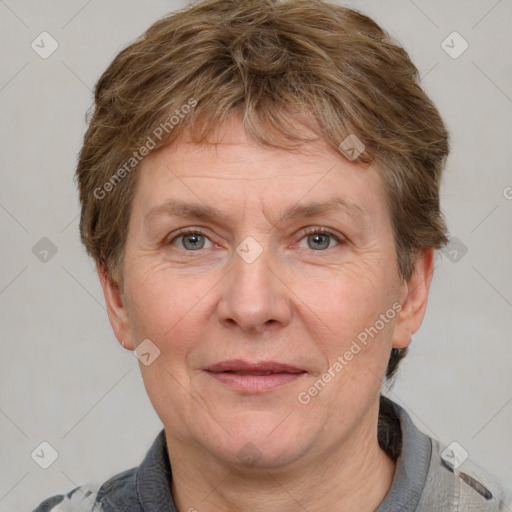 Joyful white adult female with short  brown hair and grey eyes