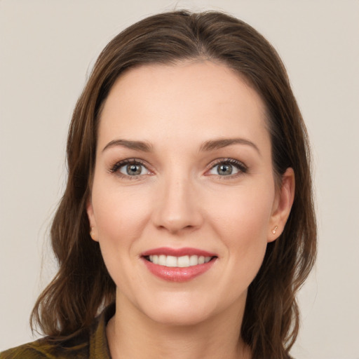 Joyful white young-adult female with long  brown hair and grey eyes