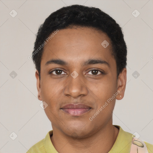 Joyful black young-adult male with short  black hair and brown eyes