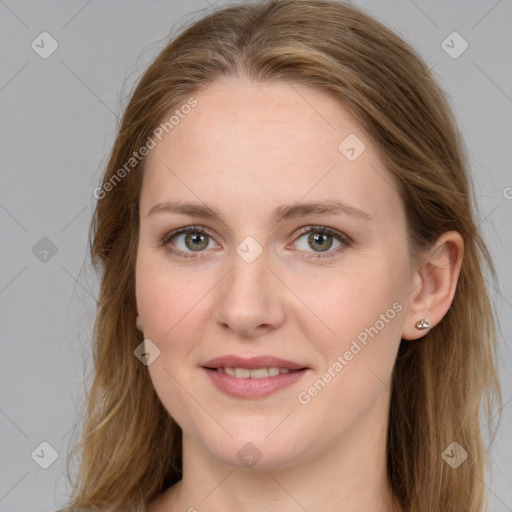 Joyful white young-adult female with long  brown hair and grey eyes