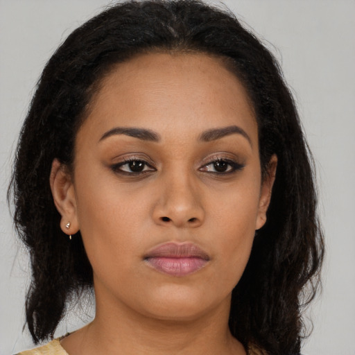 Neutral latino young-adult female with long  brown hair and brown eyes