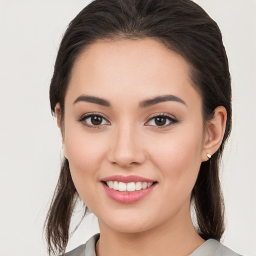 Joyful white young-adult female with medium  brown hair and brown eyes