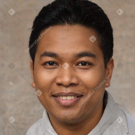 Joyful latino young-adult male with short  black hair and brown eyes