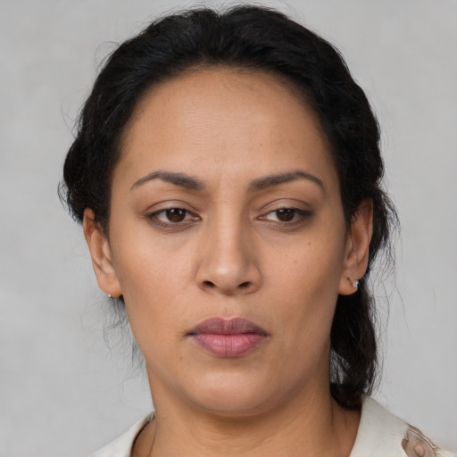 Neutral latino adult female with medium  black hair and brown eyes