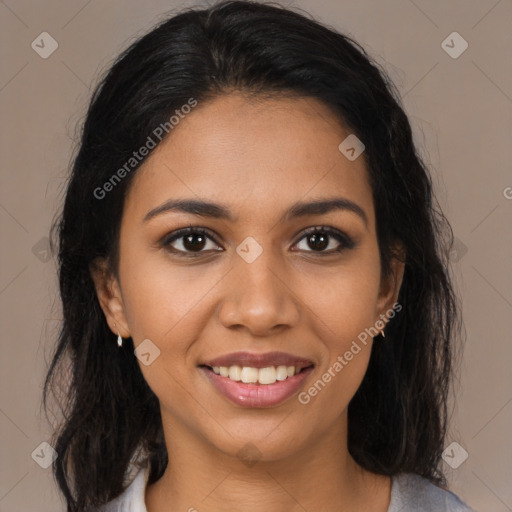 Joyful latino young-adult female with long  brown hair and brown eyes