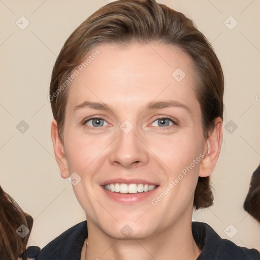 Joyful white young-adult female with medium  brown hair and grey eyes