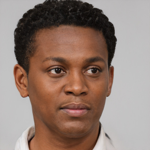 Neutral black young-adult male with short  brown hair and brown eyes
