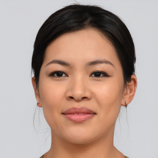 Joyful asian young-adult female with medium  brown hair and brown eyes