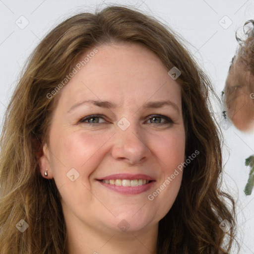 Joyful white adult female with long  brown hair and grey eyes