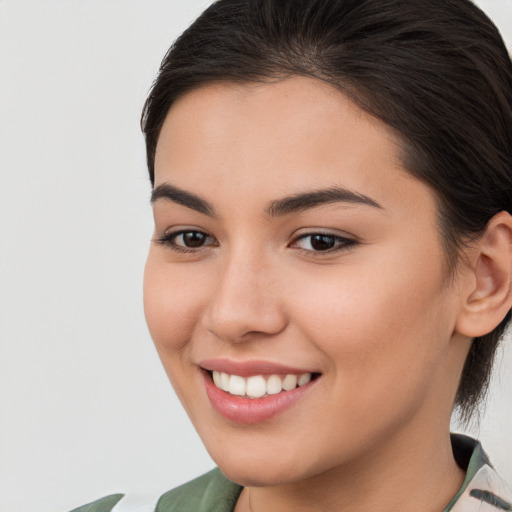 Joyful white young-adult female with medium  brown hair and brown eyes