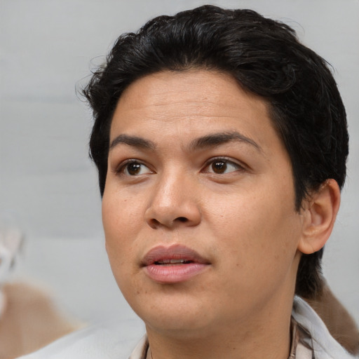 Joyful asian adult female with short  black hair and brown eyes