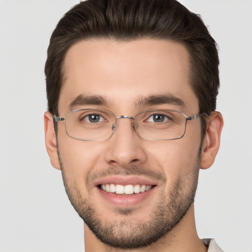 Joyful white young-adult male with short  brown hair and brown eyes