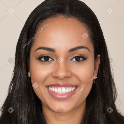 Joyful latino young-adult female with long  black hair and brown eyes