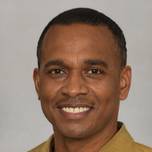 Joyful latino adult male with short  black hair and brown eyes
