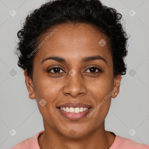 Joyful black young-adult female with short  brown hair and brown eyes