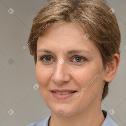 Joyful white adult female with medium  brown hair and grey eyes