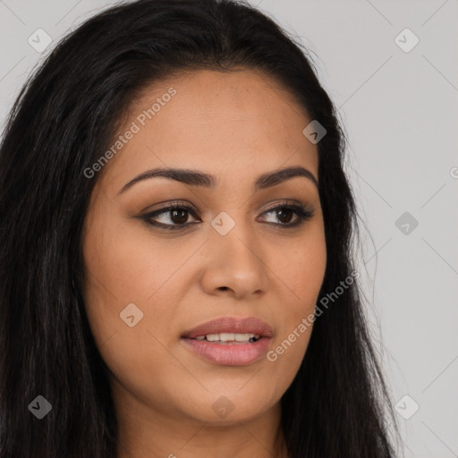 Joyful latino young-adult female with long  brown hair and brown eyes