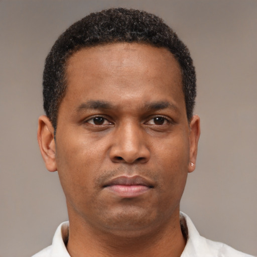 Neutral latino young-adult male with short  brown hair and brown eyes